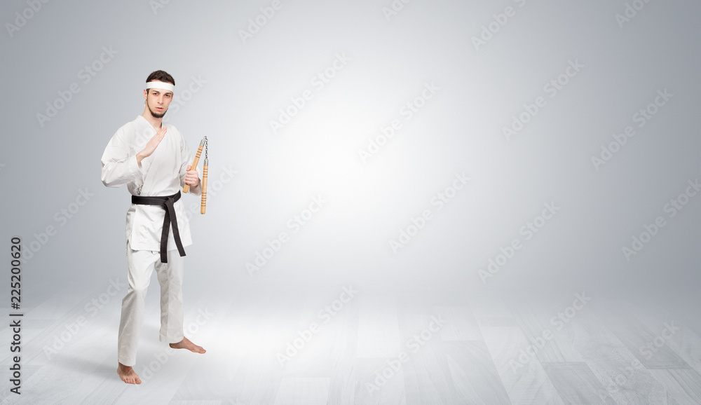 Young kung-fu trainer fighting in an empty space
Young kung-fu trainer fighting in an empty space