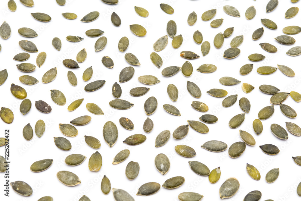 Pumpkin seeds in natural condition, isolated on white background Pumpkin seeds in natural condition, isolated on white background