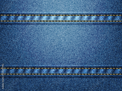 Blue denim background with golden thread stitches