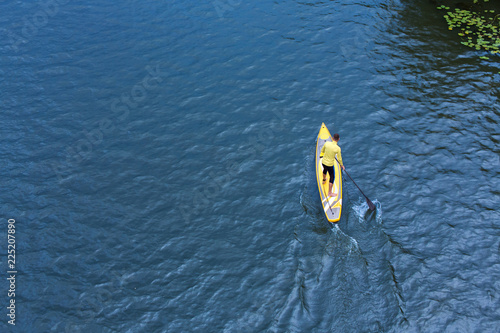 athletic man stand up paddle board SUP © serguastock