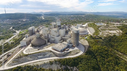 Verkhnebakansky cement plant, top view. Factory for the production and preparation of building cement. Cement industry.