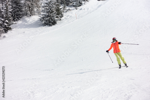 Young girl ski on groomed slope