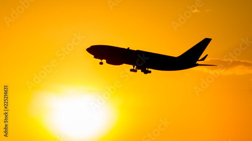 A flying airliner in the evening sky - a contour photography in the backlight. Contre-jour is a photographic technique in which the camera is pointing directly toward a source of light.
