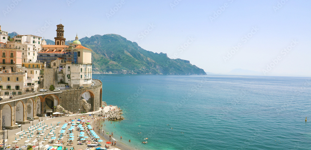 Stunning sunny view of Atrani village overhanging the sea, Amalfi Coast, Italy. Banner panorama. Copy space.