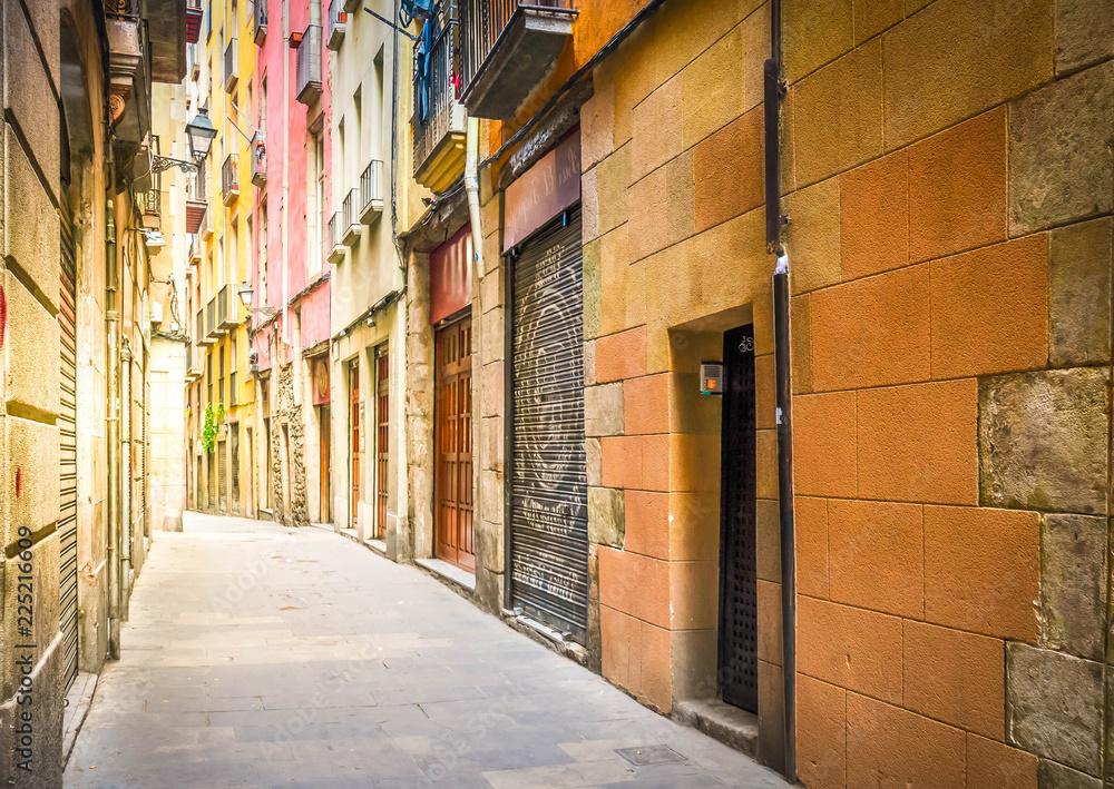 narrow street in Barrio Gotic quarter of Barcelona, Spain, toned