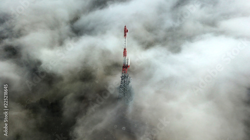 The Swisscom Broadcast transmission tower amongst clouds on top of La Barillette (1525m) in the Swiss Jura mountain