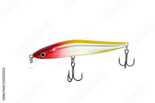 Fishing wobbler with red head, yellow back and white belly. Close-up on a white background.