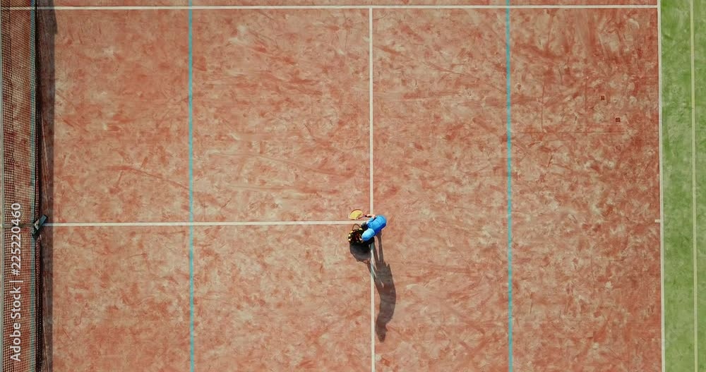 Little boy playing tennis. Little boy in tennis serving. Aerial view. Little boy playing tennis. Little boy in tennis serving. Aerial view.