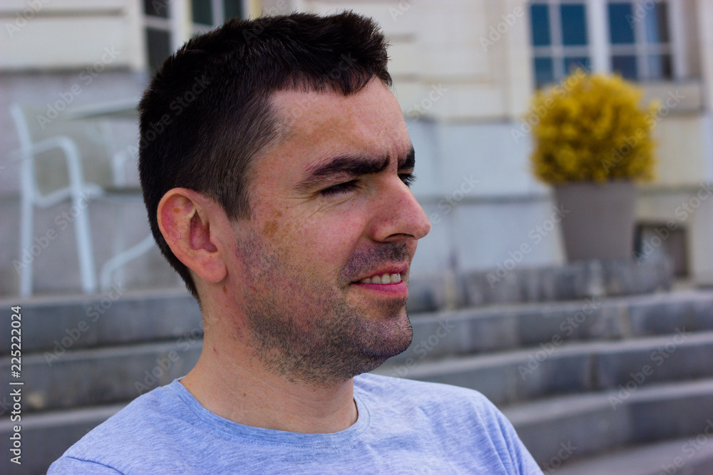 unshaven middle-aged man in a dreamy smile unshaven middle-aged man in a dreamy smile