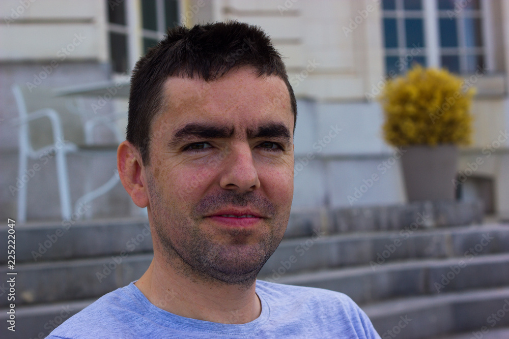 unshaven middle-aged man in a dreamy smile unshaven middle-aged man in a dreamy smile