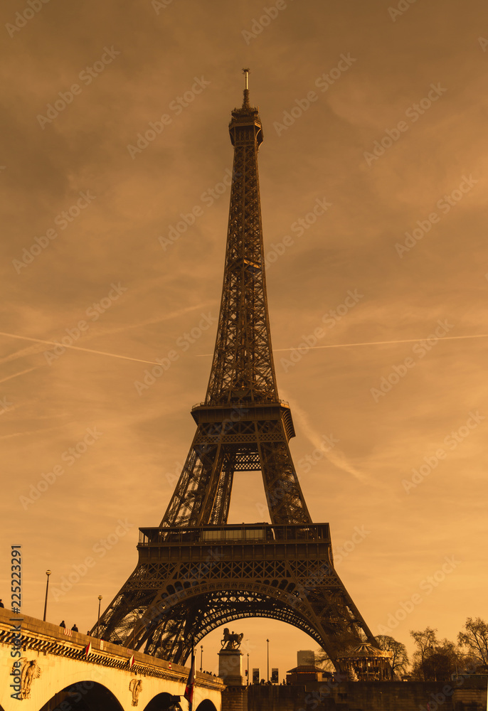 Eiffel tower, famous Paris, France tourist destination against blue sky.