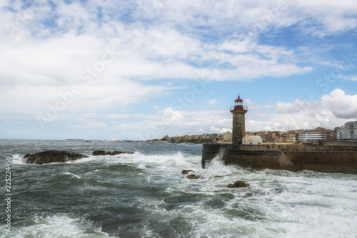 Lighthouse in Foz on Douro river. Porto, Portugal. Atlantic ocean. photo