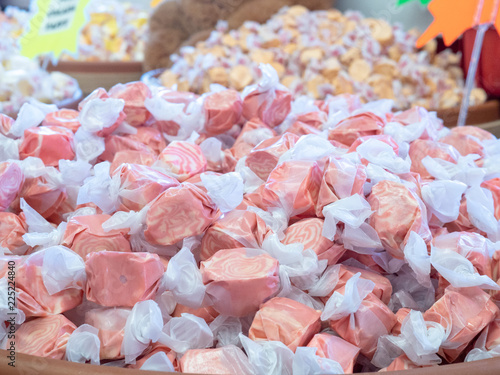 Canvas-taulu A close up of mound of strawberry taffy candy ready to purchase