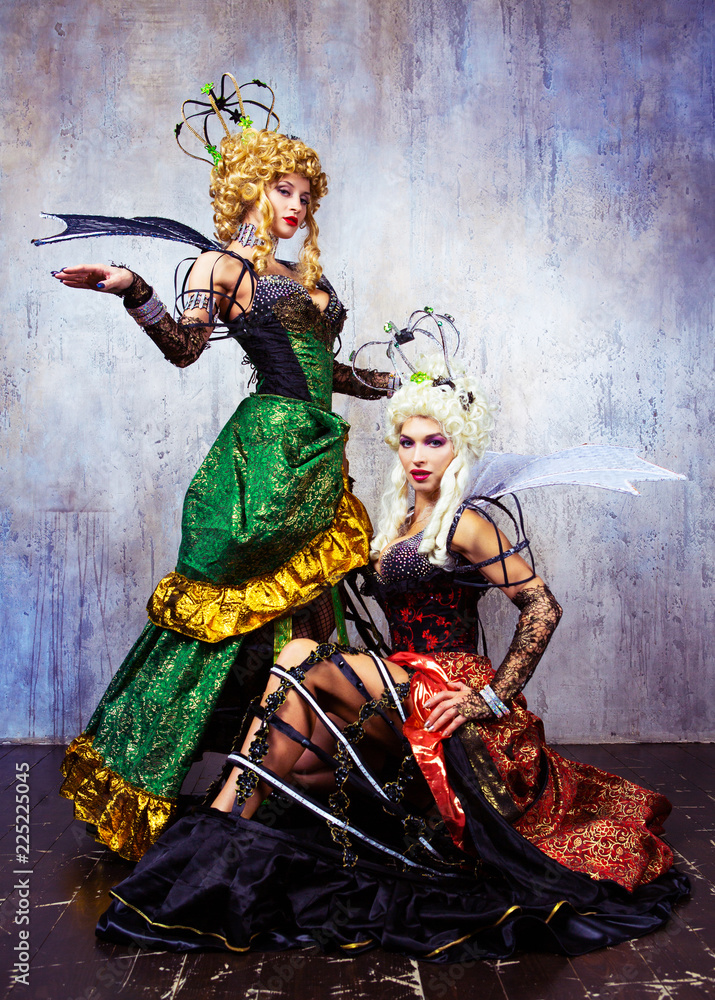  models wearing Halloween costume of a queen