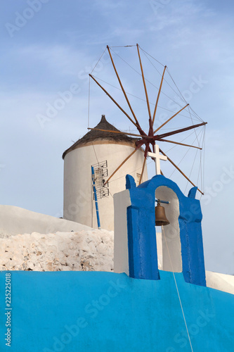 Old white traditional windmill in Oia village on Santorini, Cyclades, Greece