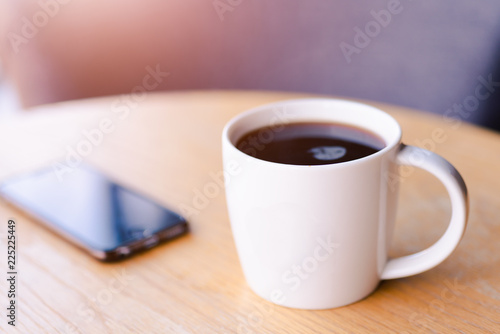 Hot espresso coffee in white cup, coffee shop