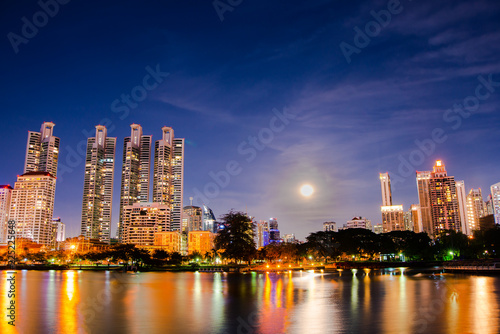 cityscape at night and a reflection of the river at Bangkok, Thailand