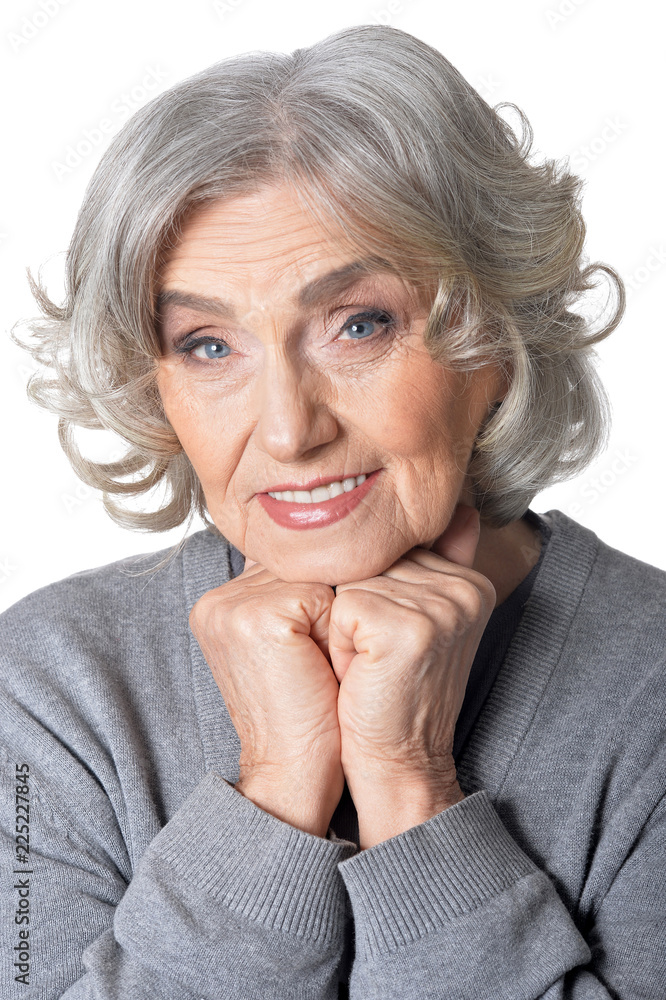 Portrait of beautiful senior woman posing on white background Portrait of beautiful senior woman posing on white background