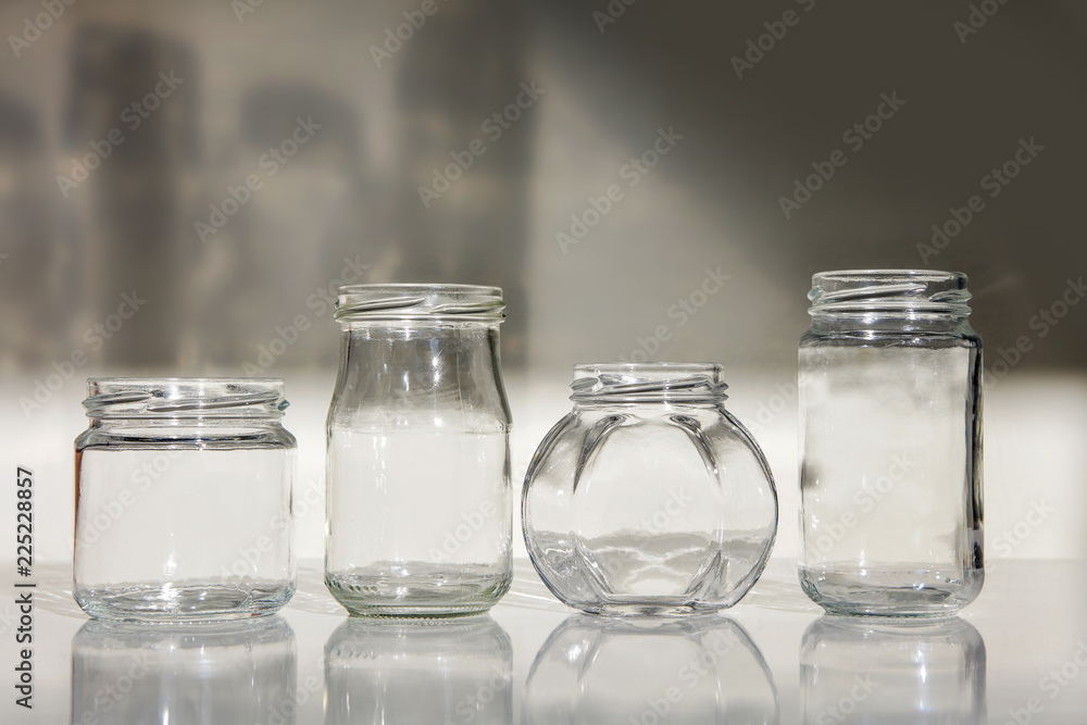 jars isolated white background glass shadow table gray glassware set empty four clear transparent black jars isolated white background glass shadow table gray glassware set empty four clear transparent black