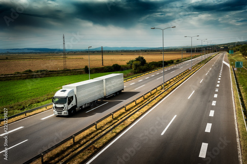 Highway transportation with white lorry a Cloudy Day © Ivan