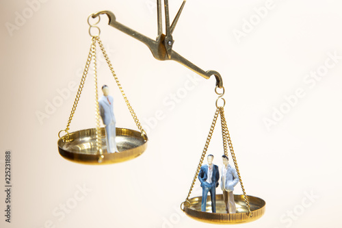 Balance between boss and employee on gold scale