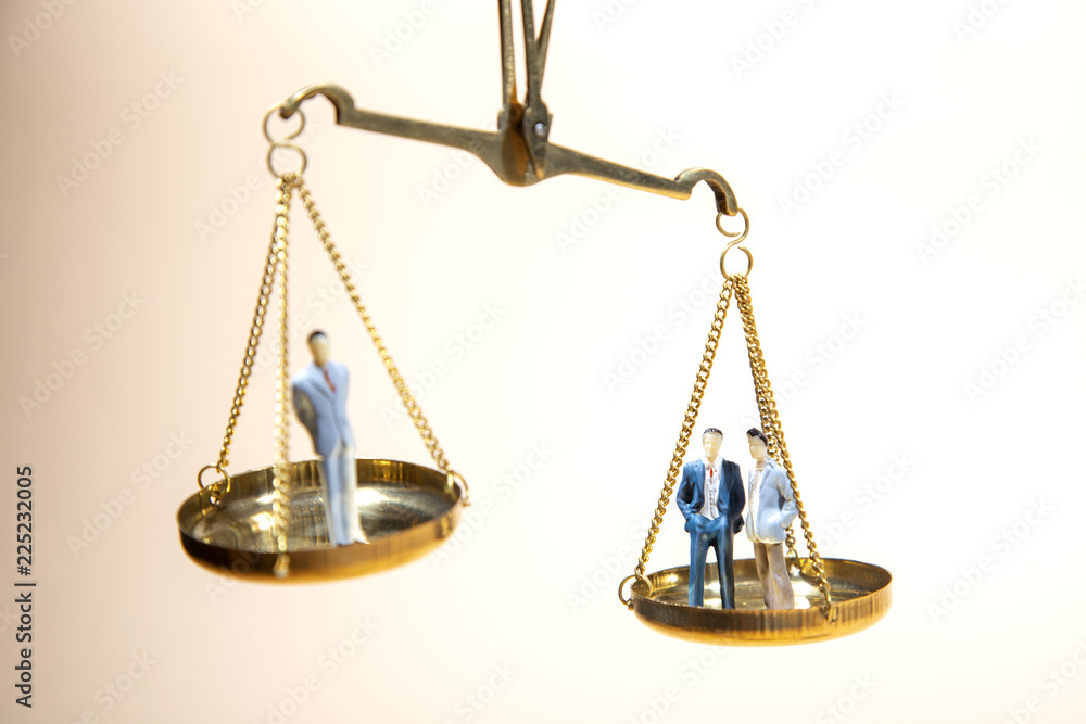 Balance between boss and employee on gold scale