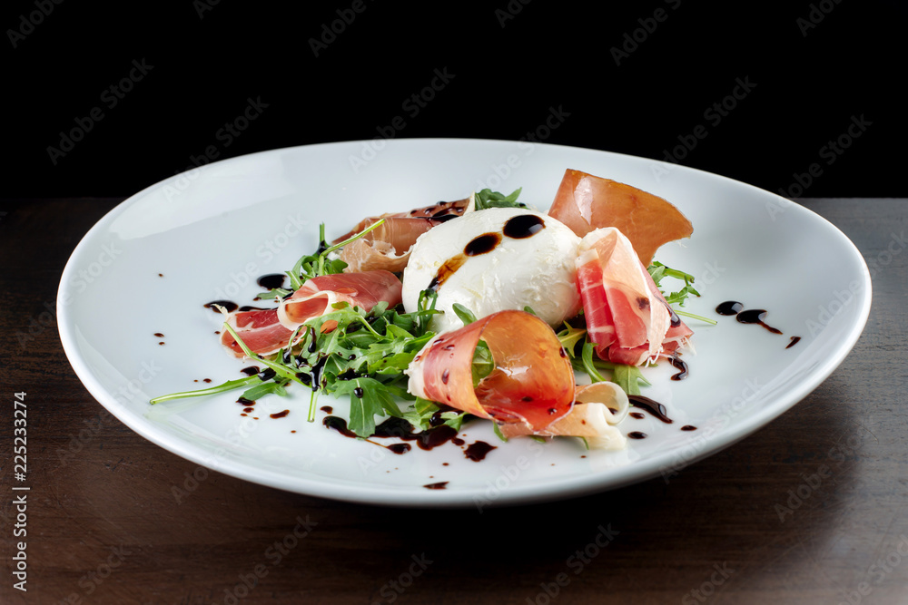 Salad with bacon and soft cheese. It is decorated with sauce-2. Salad with bacon and soft cheese. It is decorated with sauce-2.