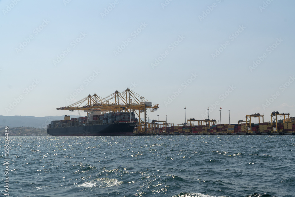 Obraz premium Docked container cargo ship at port.