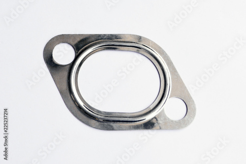 automotive steel gasket for the exhaust system isolated on white background