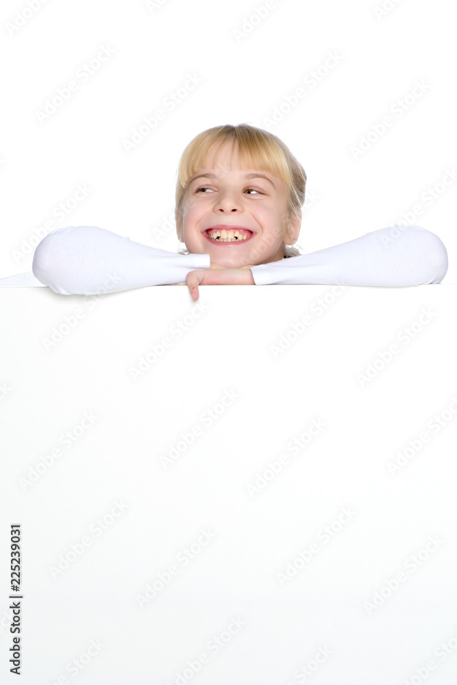 A little girl is looking from behind an empty banner. A little girl is looking from behind an empty banner.