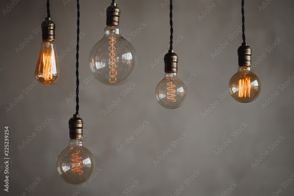 Set edison retro lamp on loft gray concrete background. Set edison retro lamp on loft gray concrete background.