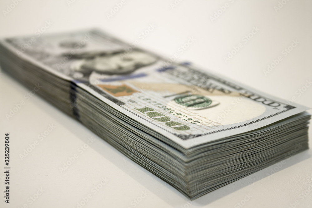 Stack of one hundred dollar banknotes close up view Stack of one hundred dollar banknotes close up view