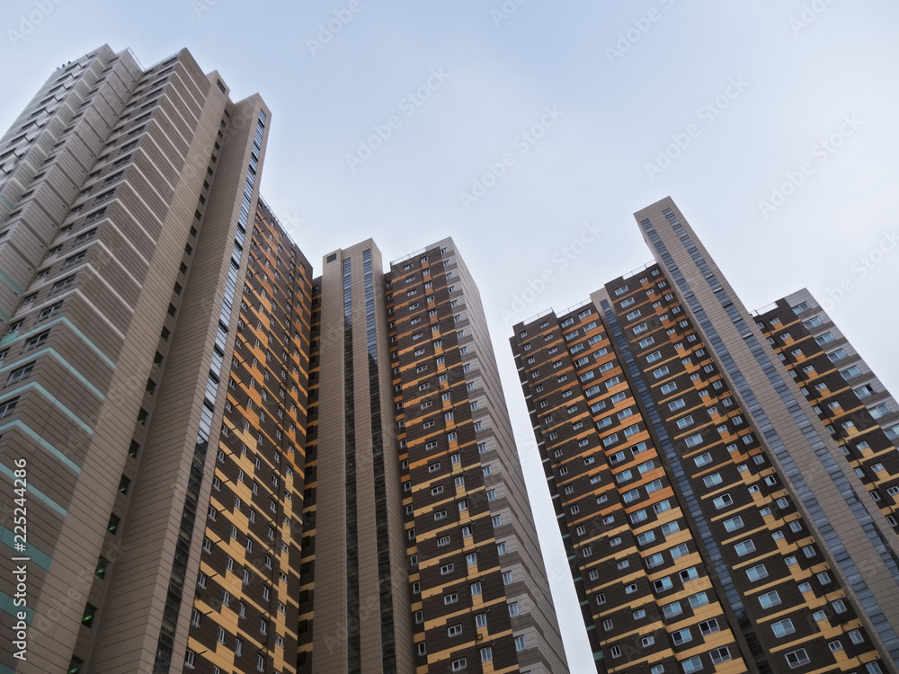 Bottom view to big building in the rich aria of Sokcho city, South Korea Bottom view to big building in the rich aria of Sokcho city, South Korea