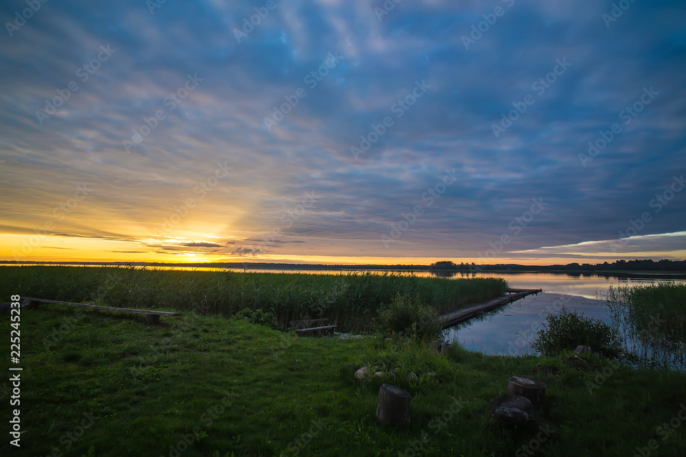 Naklejka premium summer landscape dawn on the shore of the lake
