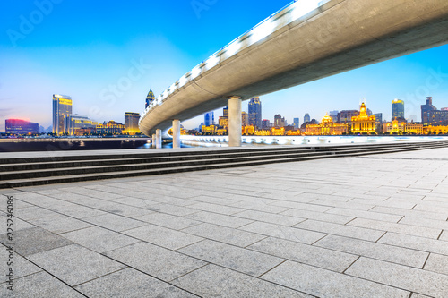 Photography Empty square floor and city skyline with bridge in Shanghai at night