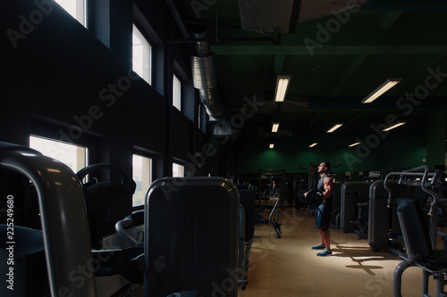 Fototapeta Naklejka Na Ścianę i Meble -  Man doing training alone in the gym