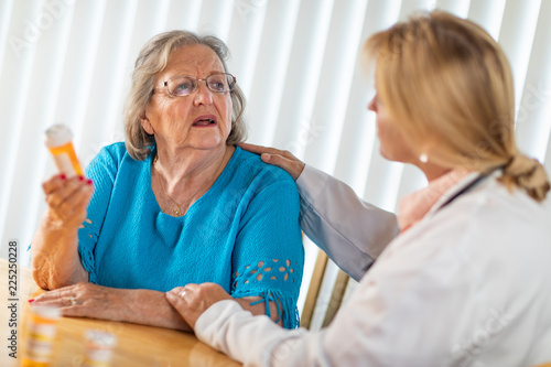 Female Doctor Talking with ...