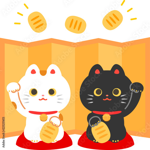 対の招き猫と金色の屏風