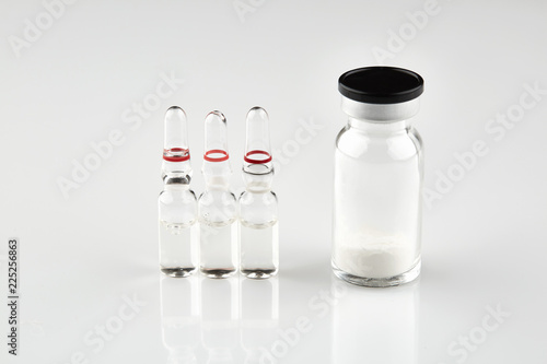 Small sealed bottle with medicine and ampoules