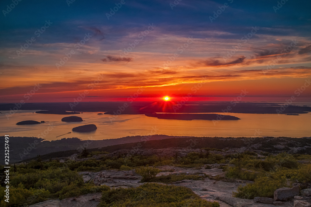 Sun breaking the horizon oveer the Atlantic Ocean viewed from Cadillac Mountain in Acadia National Park