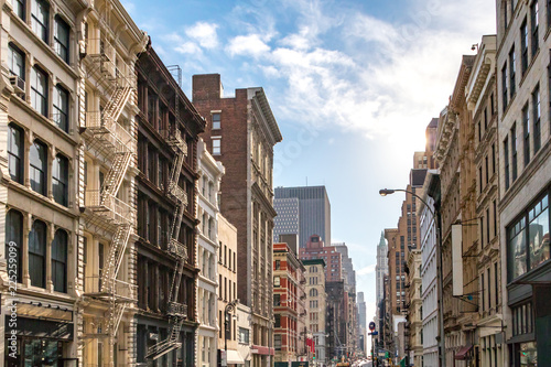 Sunlight shines on the buildings along Broadway in SoHo, New York City © deberarr