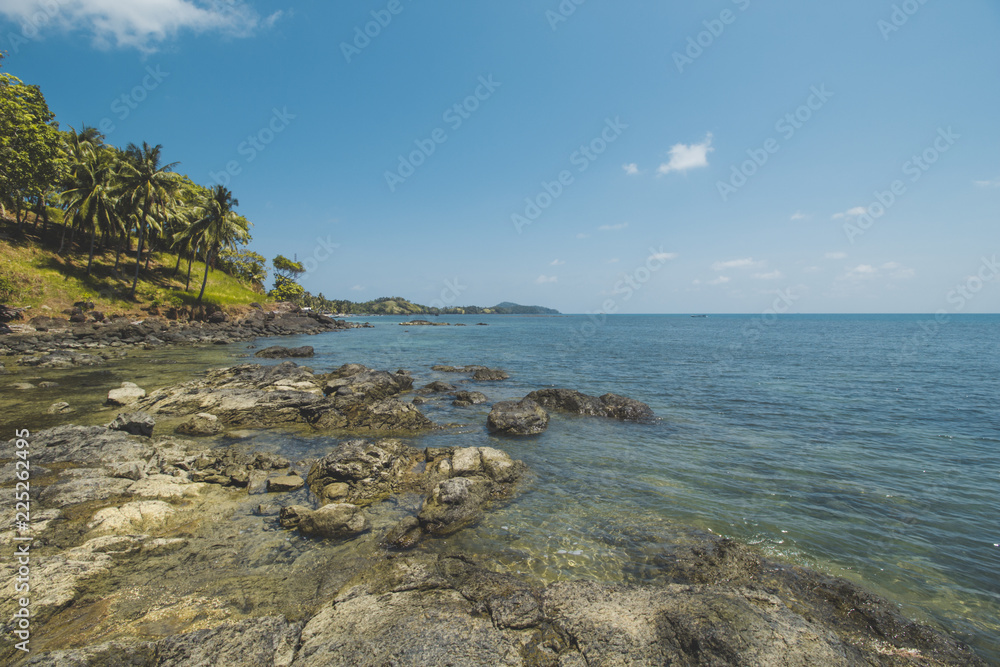 Beautiful Tropical Beach with Granite Rocks and Blue Sky