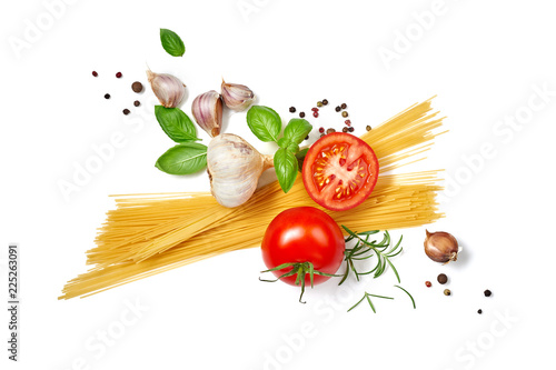 Spaghetti pasta with tomatoes garlic and basil isolated on white background. Top view.