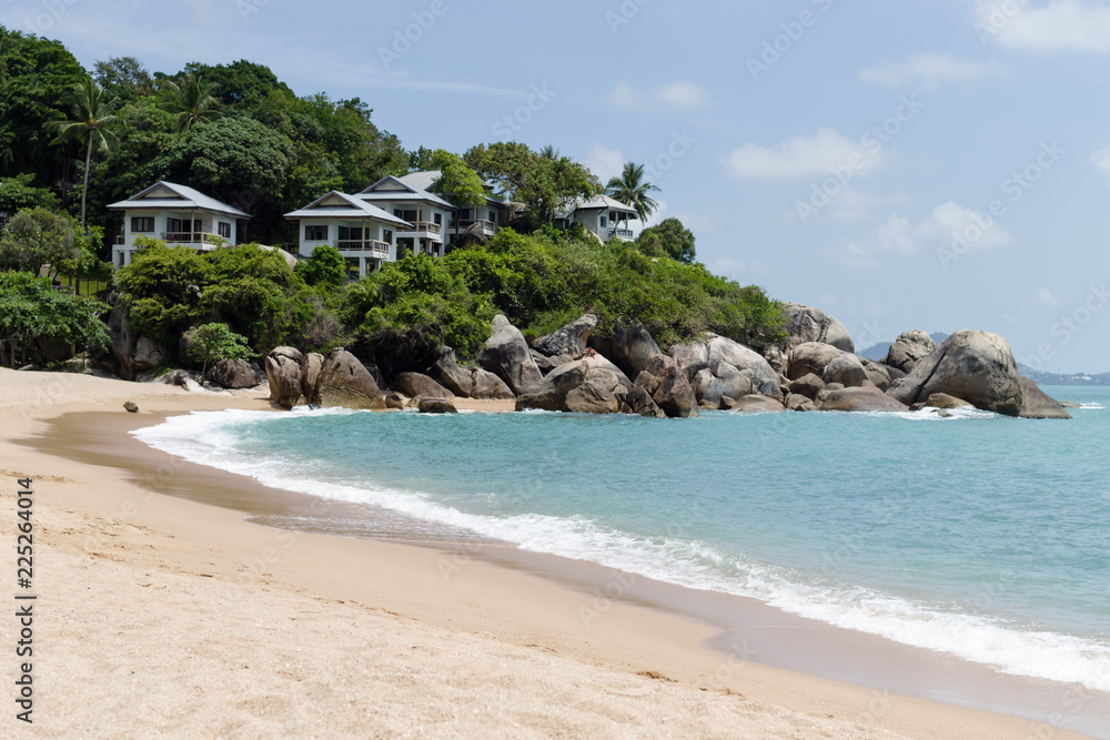 Beautiful tropical view of blue sky, sandy beach, and blue tropical sea in Koh Samui, Thailand
