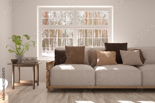 Idea of white room with sofa and forest landscape in window. Scandinavian interior design. 3D illustration © AntonSh