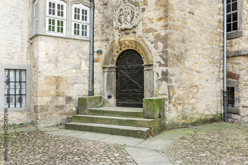 closed heavy door in the inner yard of wolfsburg castle  germany