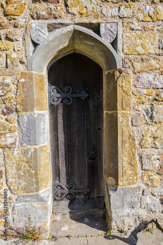 Ancient doorway in church wall photo