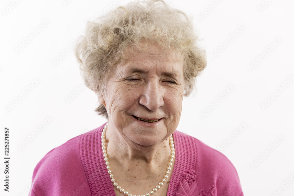 Old woman smiles, close-up, isolated on white background Old woman smiles, close-up, isolated on white background