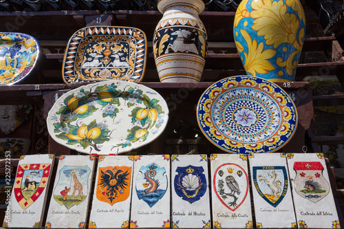 Siena Italy July 1st 2015 : Ceramic vases and tiles featuring some of the districts represented in the famous palio horse race © Michael Evans