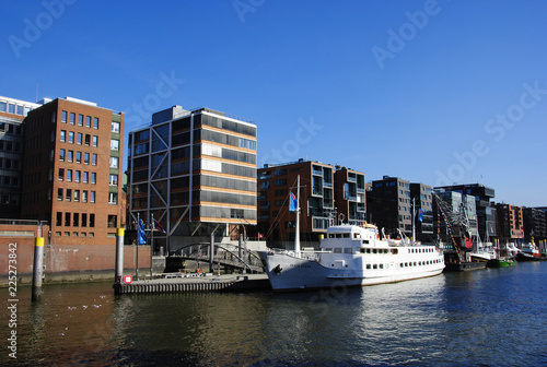 high and modern houses near a river arm of the Elbe in Hamburg Germany